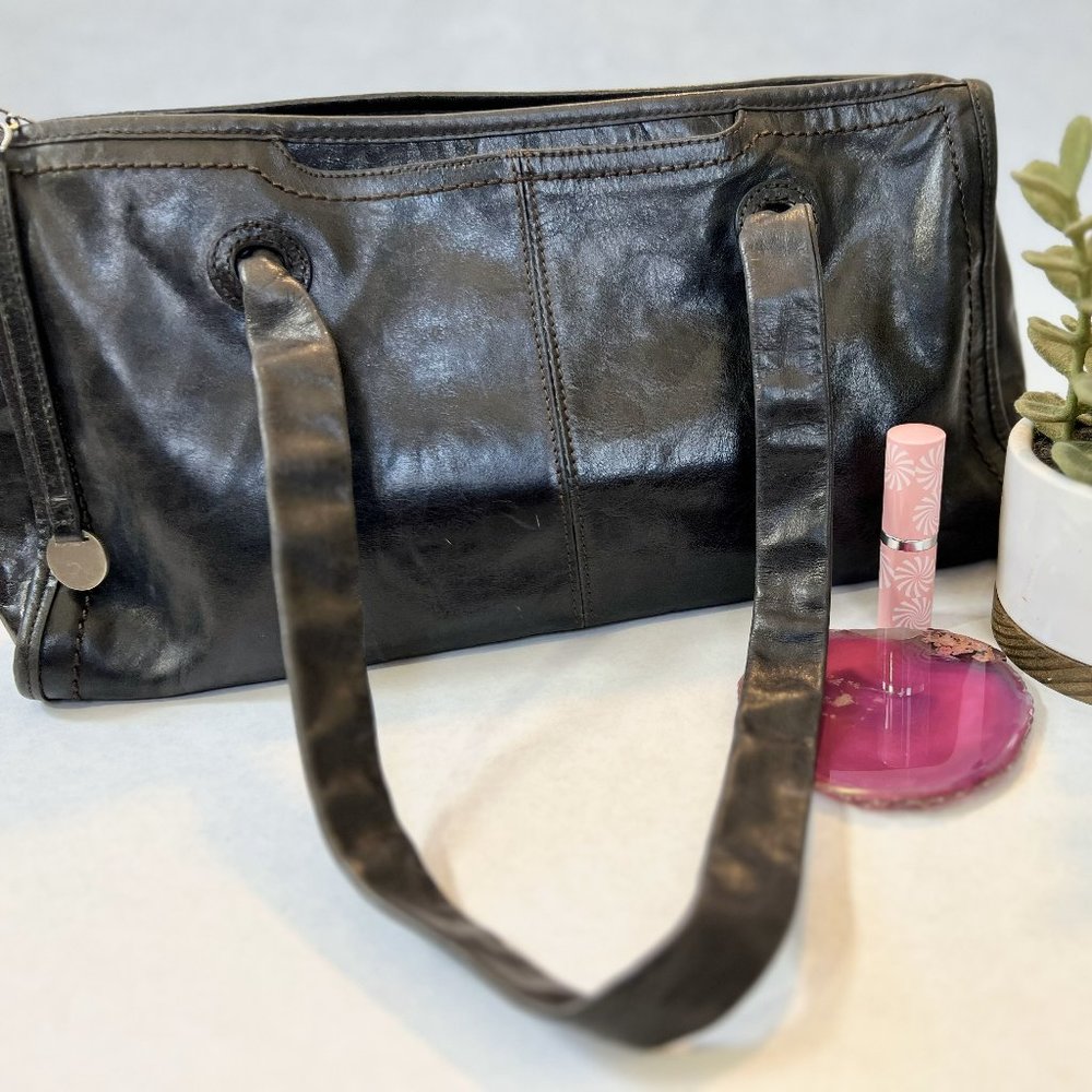 Black leather HOBO brand barrel bag